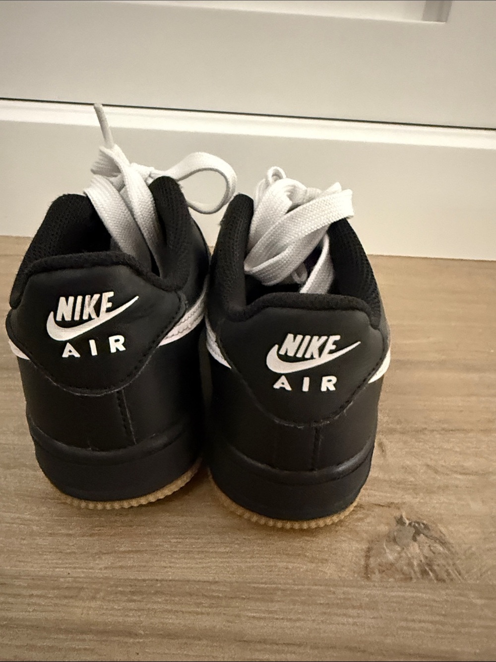 Nike Air Force1 Kids Black Leather Low-Top Sneakers with White Swoosh - Picture 4 of 6
